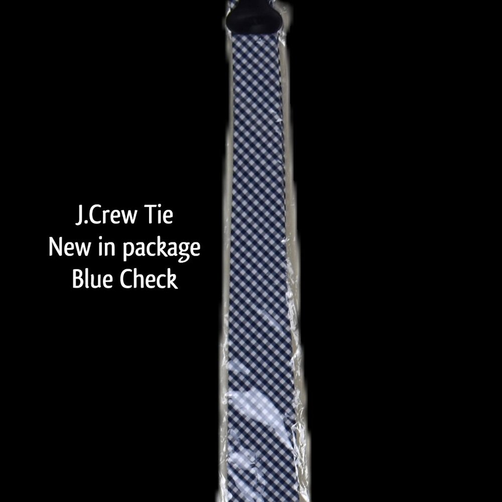 J.CREW tie in a classic blue check. Perfect for any occasion, this tie adds a to